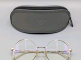 glasses in a case and glasses on a white surface