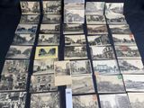 a lot of old postcards that are on the table