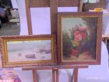 two paintings on a easel with a boat in the background