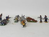 a lot of figurines that are sitting on a table