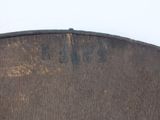 a close up of a piece of wood with writing on it
