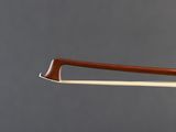 a close up of a violin bow with a wooden handle
