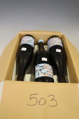 three bottles of wine in a box with a price tag
