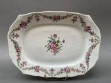 a white plate with a floral design on it