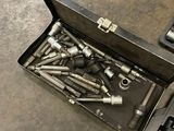 a tool box filled with various tools on a table