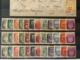some old stamps are on display on a table with a piece of paper