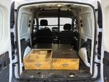 a white van with two drawers in the back of it