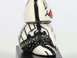 a black and white statue of a rabbit with a crown on its head