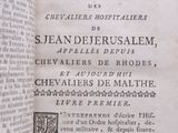 an open book with a black and white image of a man on a horse