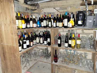 many bottles of wine on the shelves in the room