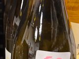 several bottles of wine on a shelf in a store