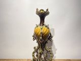 a vase that is sitting on a wooden table