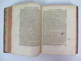 an open book on a white table with a white background