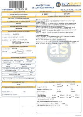 un gros plan d'un document sur lequel figure la photo d'une voiture