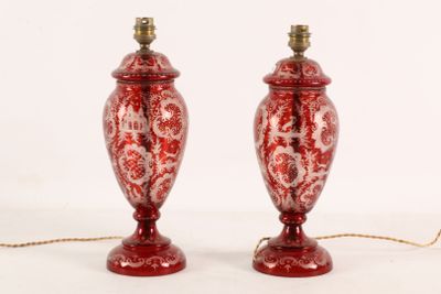two red lamps that are sitting on a table