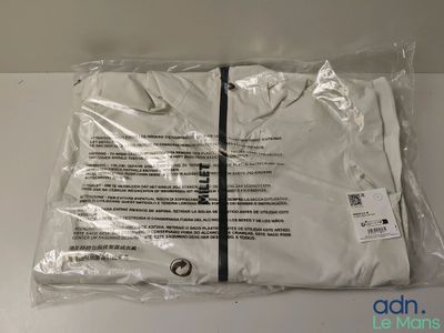 the white shirt is wrapped in plastic and ready to be shipped