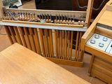 a wooden table with a musical instrument on it