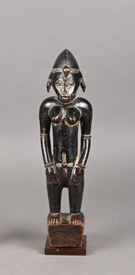statue of a man with a helmet on his head, standing on a wooden base