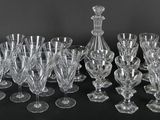 a lot of wine glasses sitting on a table