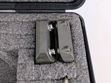a black case with a gun inside of it
