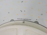a close up of a bathroom sink with a lot of lights