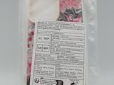 a bag of pink and white candies in it