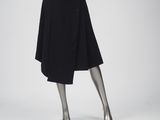 an image of a mannequin dressed in a black skirt and top