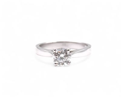 a close up of a diamond ring on a white background
