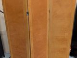 a room divider that has a picture on the wall