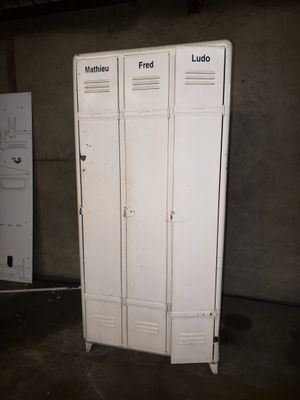 two white lockers that are in a room