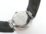 a close up of a wrist watch on a white surface