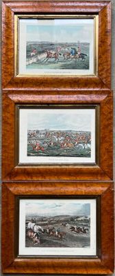 three framed pictures of horses racing on a track in a wood frame