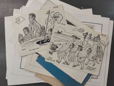 une pile de cartes sur lesquelles sont dessinées des personnes