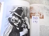 a book with a picture of an old man in a hat and scarf