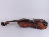a close up of a violin with a bow on a white background