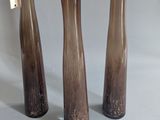 three vases that are sitting on a table