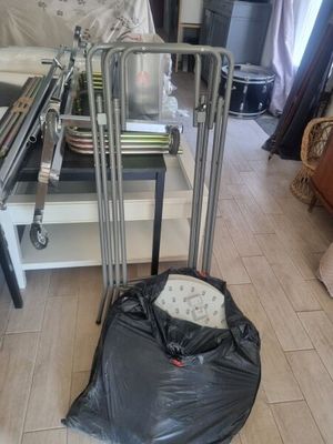 a black bag sitting on the floor next to a luggage bag