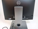 a dell monitor and a mouse on a desk