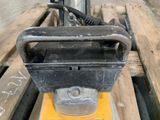 a close up of a forklift on a pallet in a warehouse