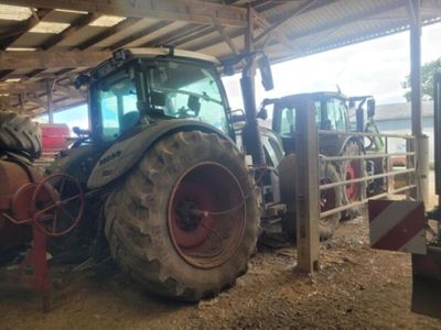 a tractor that is parked inside of a building