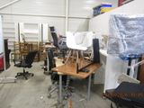 a room with a lot of chairs and desks