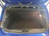 a blue car with its trunk open on the street