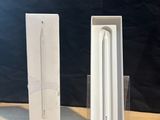 a white box with a white apple pencil inside of it