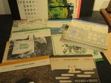 a lot of books on a table with a calendar on it