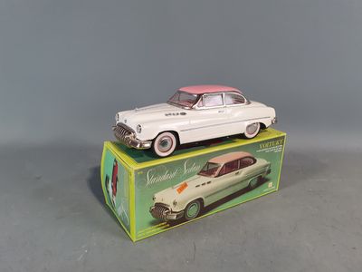 a toy car sitting on top of a box on a table
