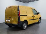 a yellow van that is parked in a room