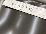 a close up of a metal surface with a ruler on it