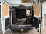 a white van that is parked in a garage
