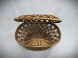 a close up of a wicker basket with a lid
