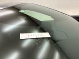 a sticker on the windshield of a silver car